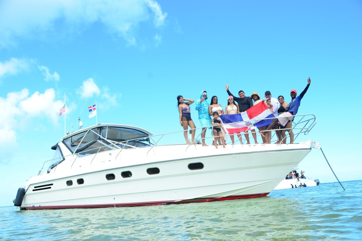 Guests enjoying a private luxury yacht charter in Punta Cana at the Natural Pool with crystal-clear Caribbean waters