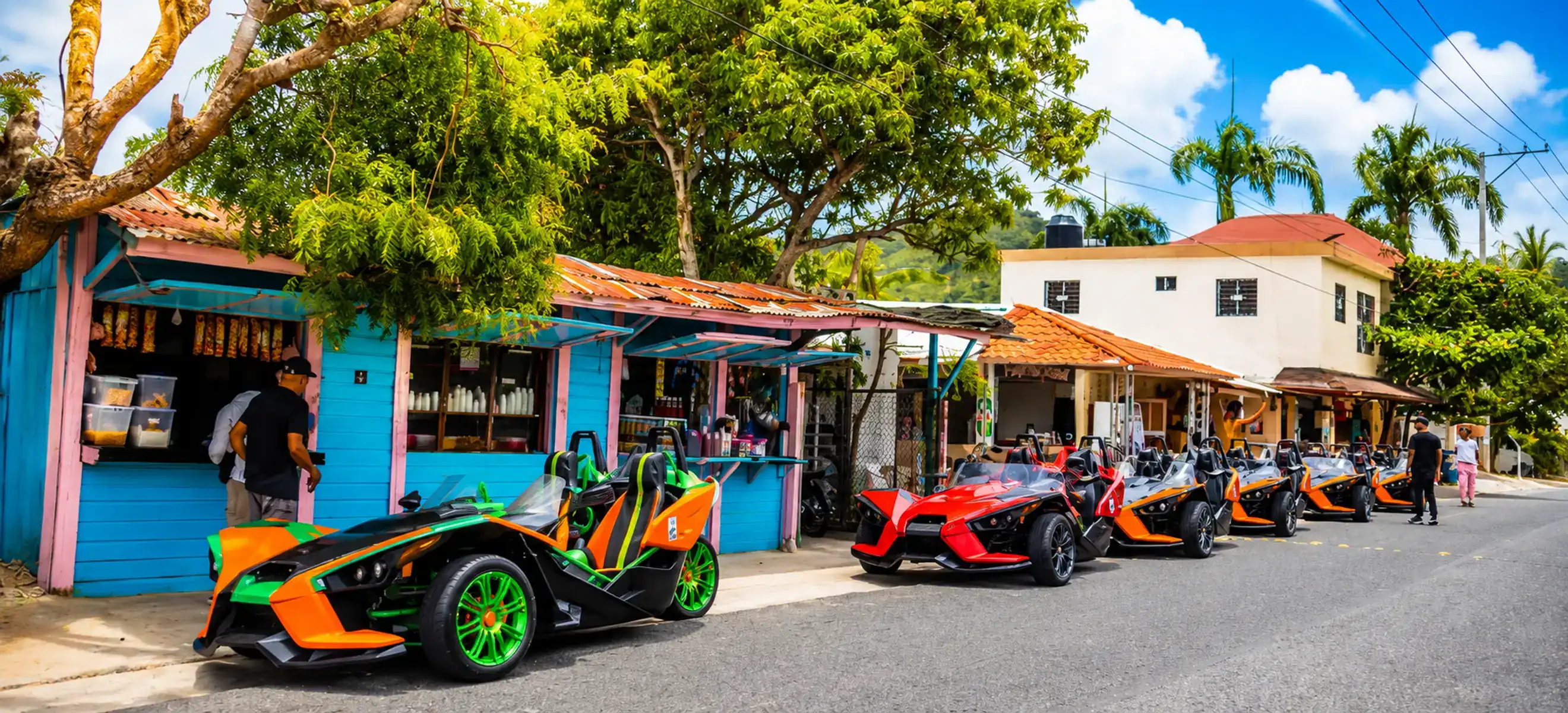 Colorful Polaris Slingshot convoy visiting a Dominican village during a Punta Cana countryside tour