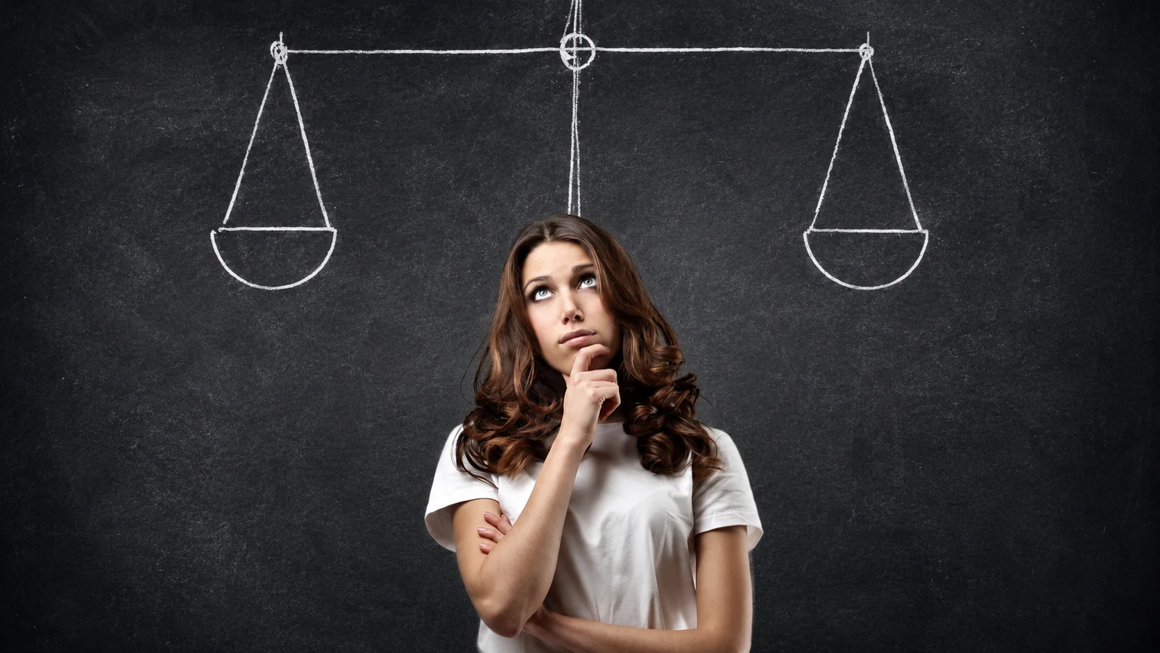 woman think about what decision to make hesitant with the scales on top