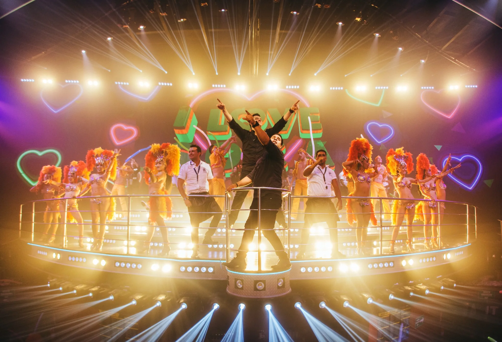 Colorful dance show with heart lights at Coco Bongo Punta Cana