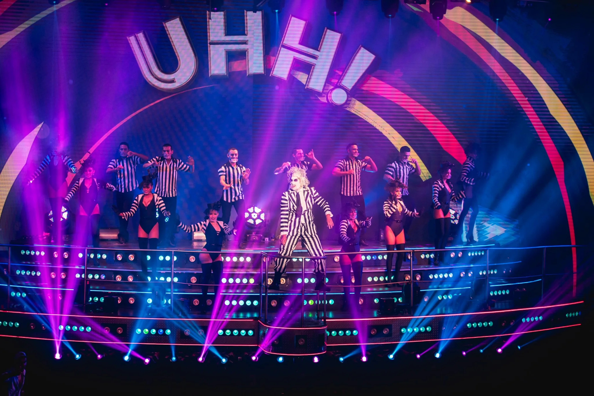 Colorful live stage performance with dancers at Coco Bongo Punta Cana
