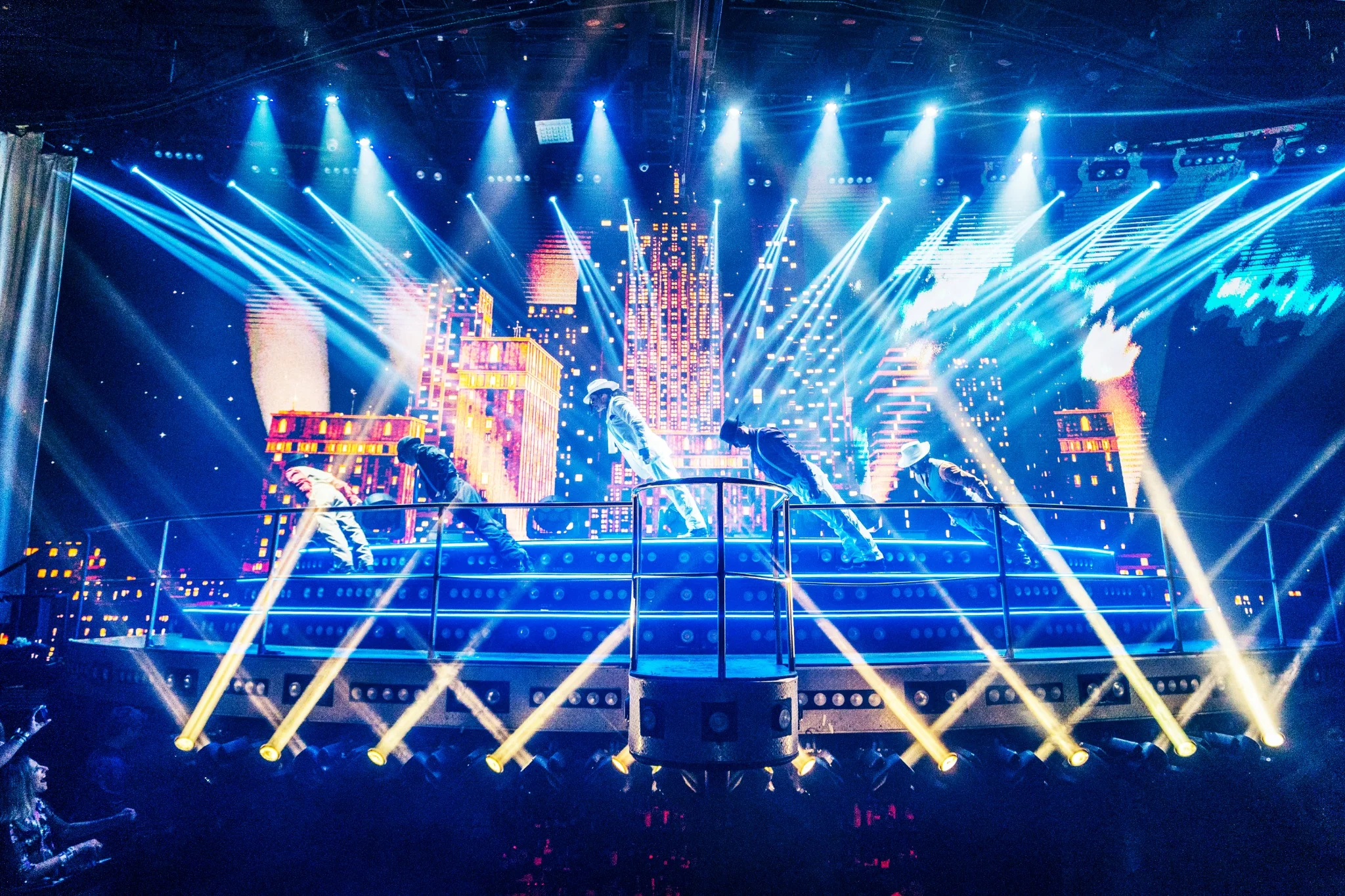 Dance performance with city skyline stage effects at Coco Bongo Punta Cana