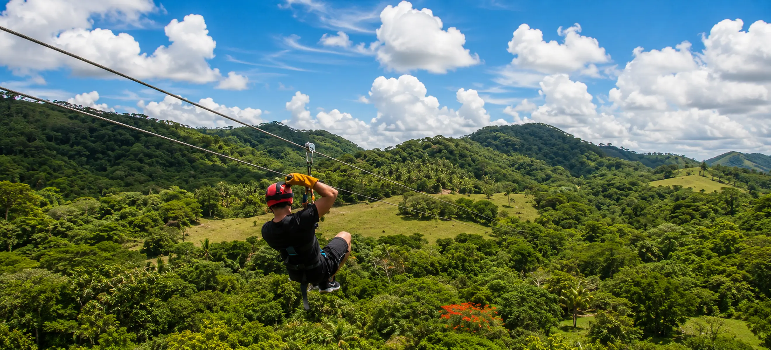 Guest ziplining above the tropical rainforest at Monkeyland Punta Cana