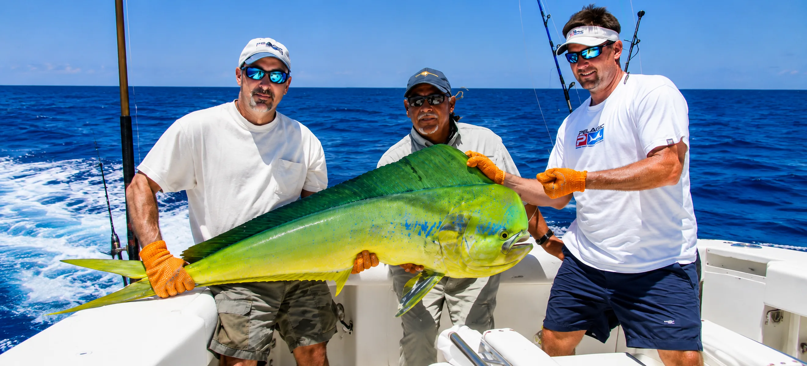 Anglers holding large mahi mahi during deep sea fishing trip in Punta Cana
