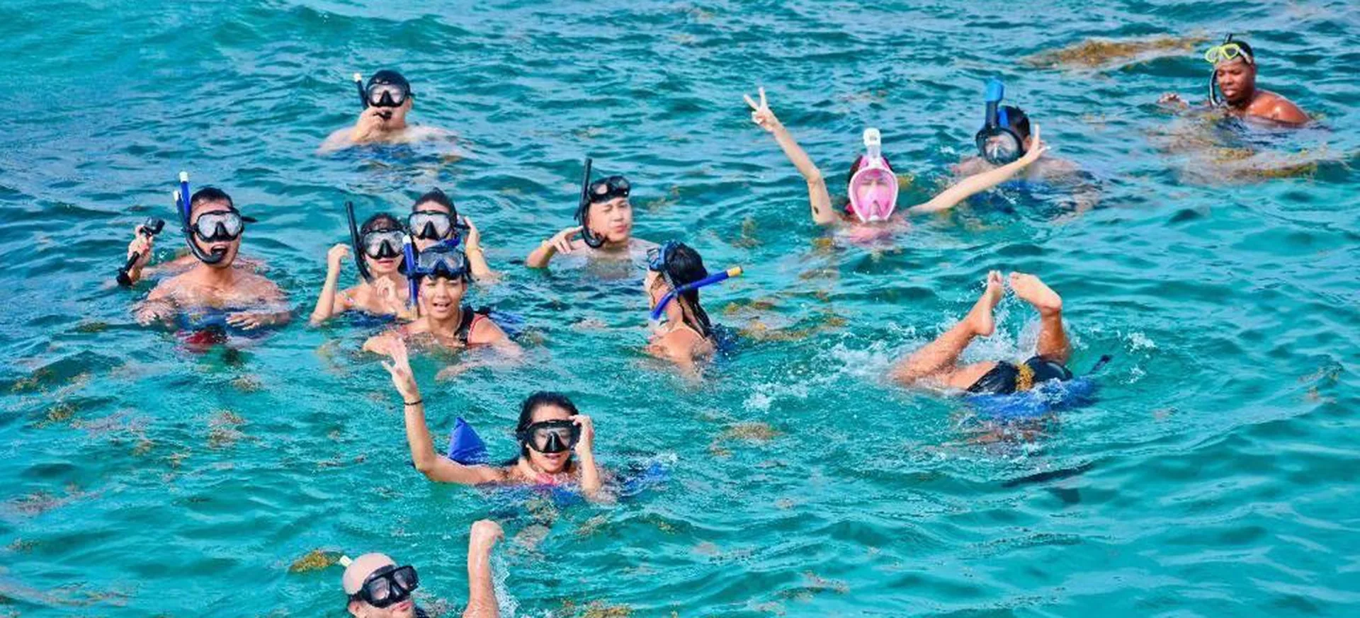 Guests snorkeling in the sea during Vibra Party Boat excursion in Punta Cana