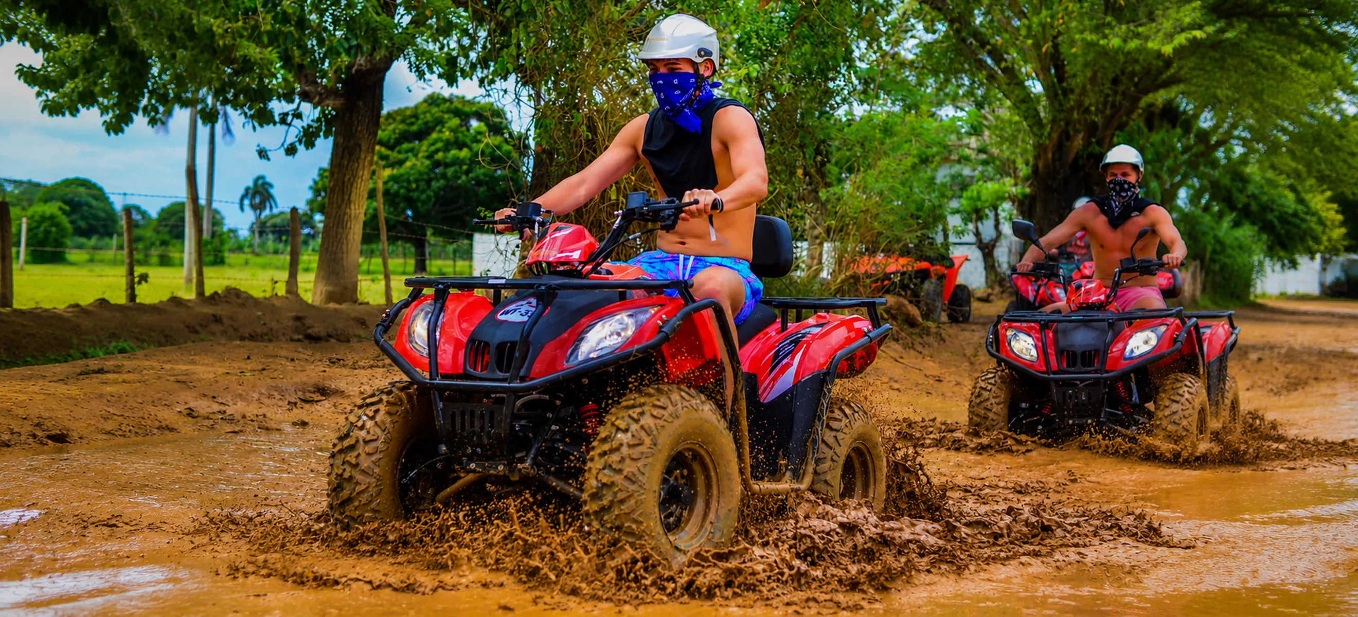 ATV riders exploring countryside dirt trail on Wild Trails excursion in Punta Cana