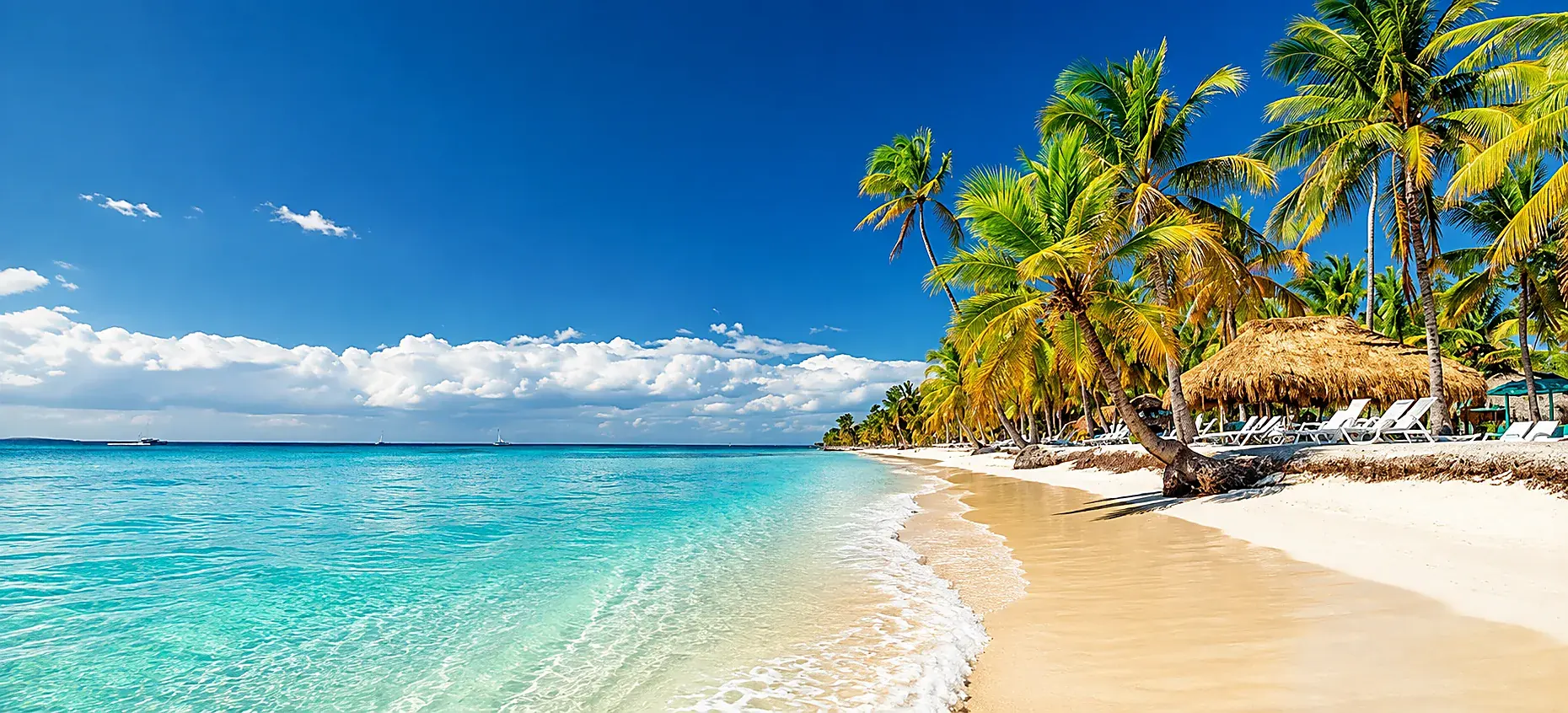 Saona Island beach with wooden dock, boats, and clear Caribbean water