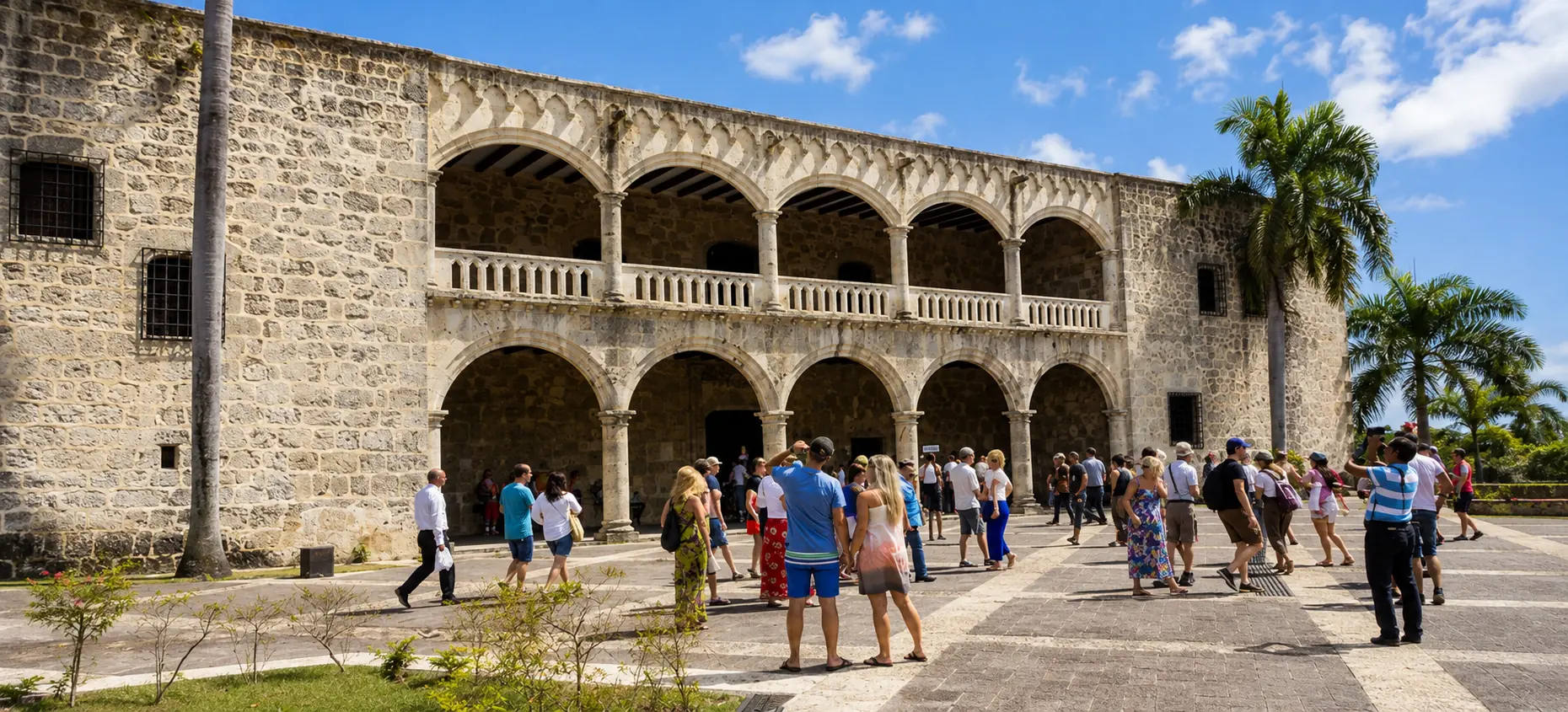 Tourists visiting the Alcázar de Colón in Santo Domingo