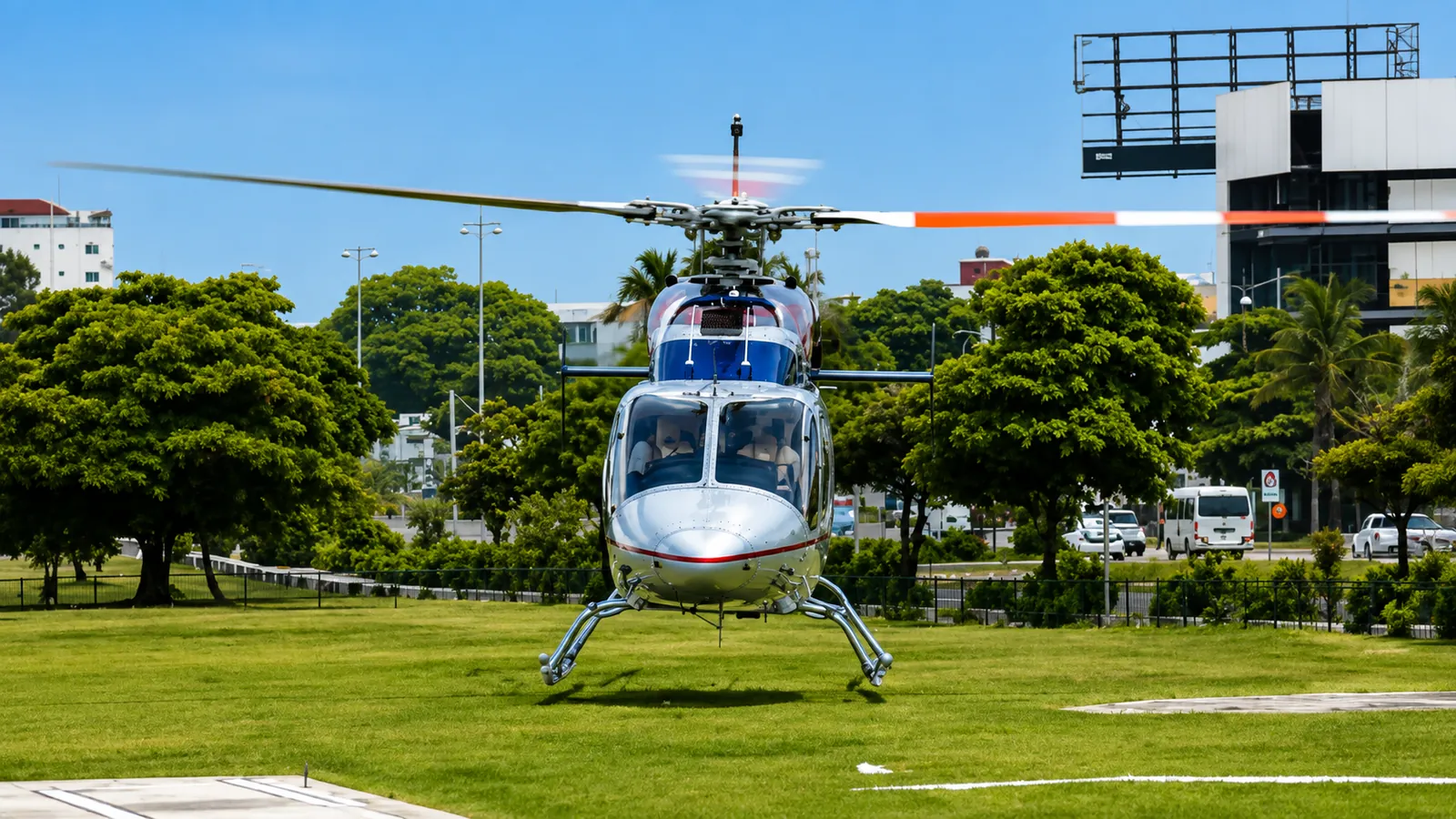 Punta Cana helicopter preparing for takeoff from a tropical landing area