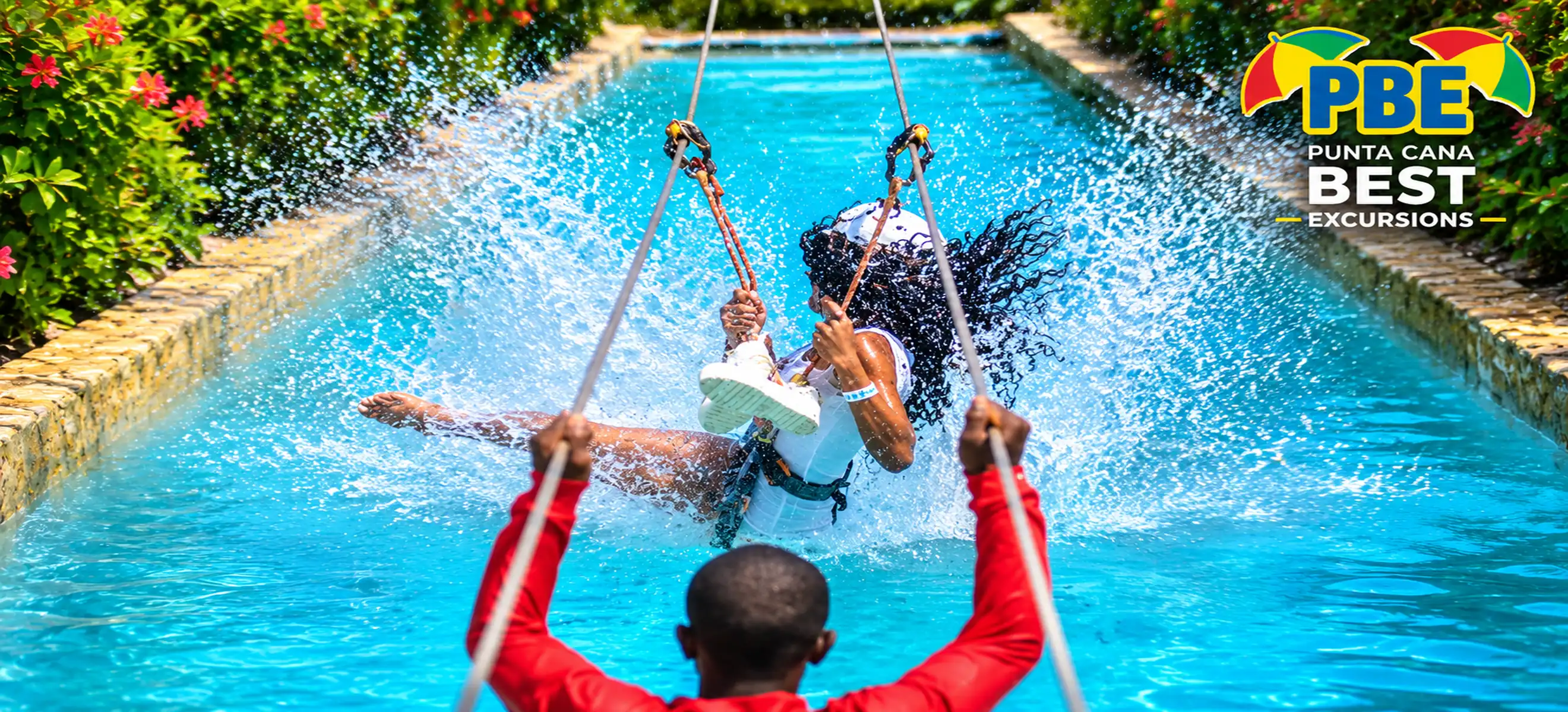 Guest splashing into the water swing at Bávaro Adventure Park Punta Cana.