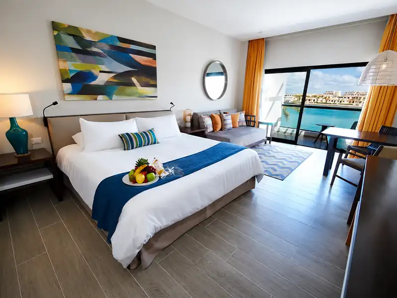 Luxury Punta Cana hotel room with balcony and marina view