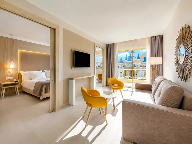 Modern family suite at Nickelodeon Punta Cana with bedroom and resort view