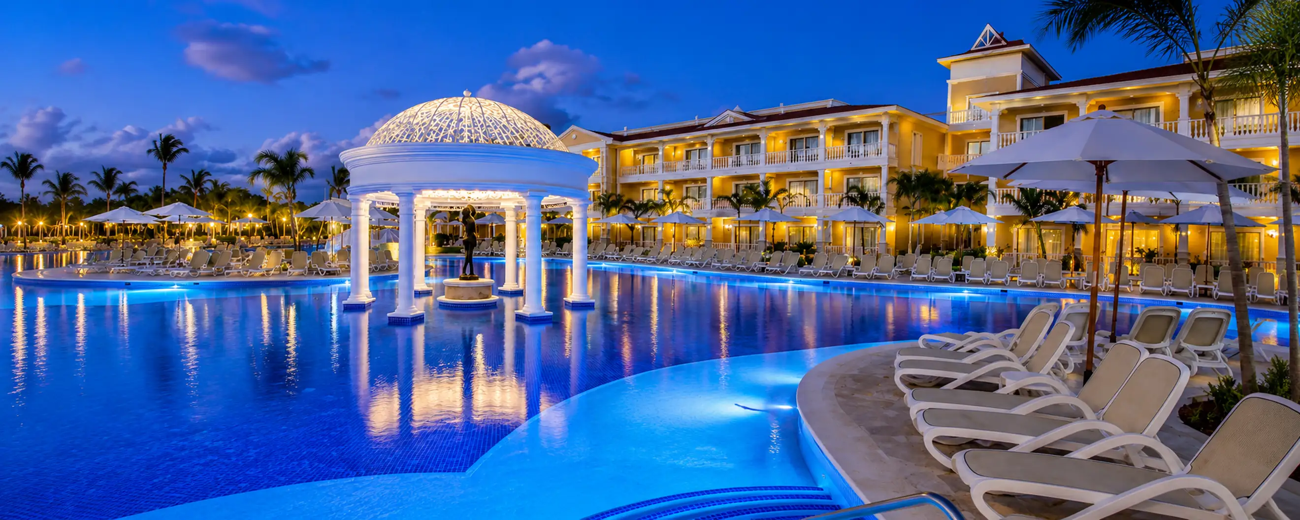 Bahia Principe Grand Aquamarine Punta Cana illuminated pool and resort at night