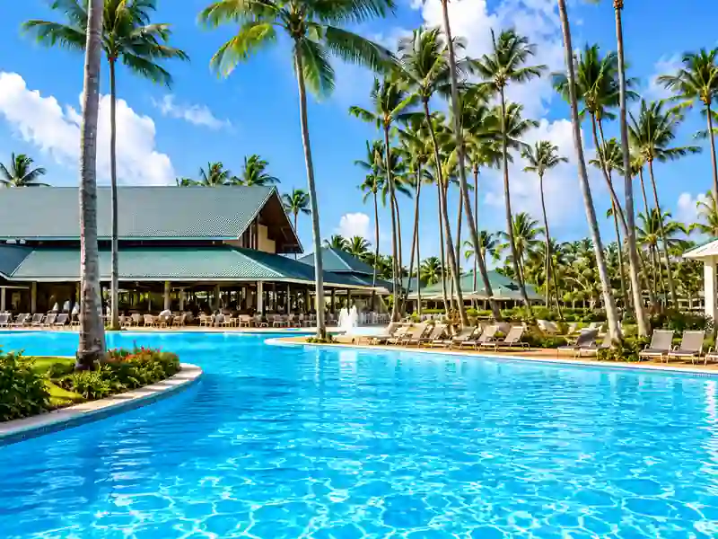 Barceló Bávaro Palace tropical swimming pool surrounded by palm trees in Punta Cana