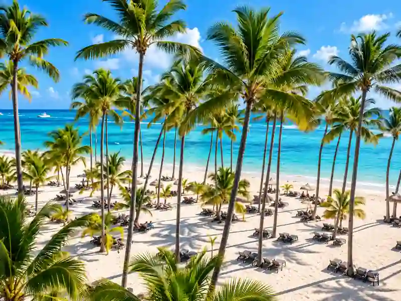 Barceló Bávaro Palace tropical beach with palm trees and turquoise Caribbean Sea in Punta Cana