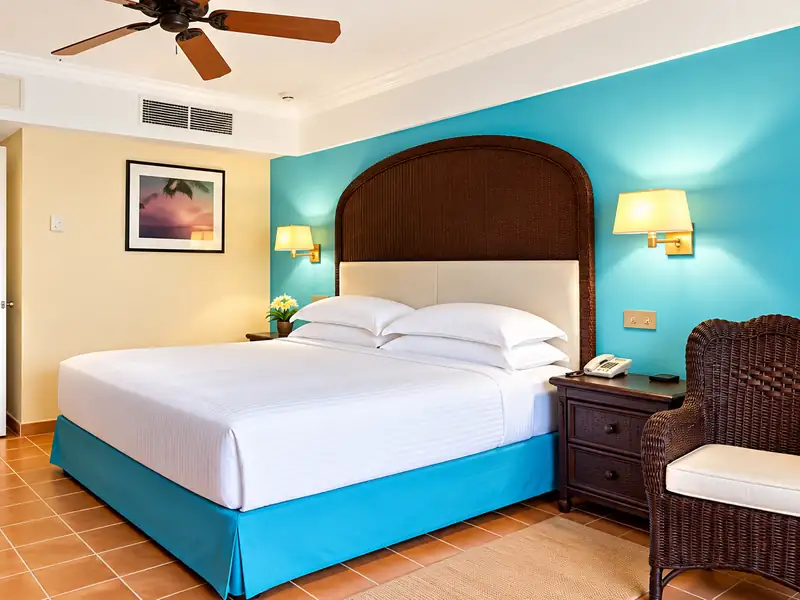 Punta Cana resort hotel room with tropical decor and king bed
