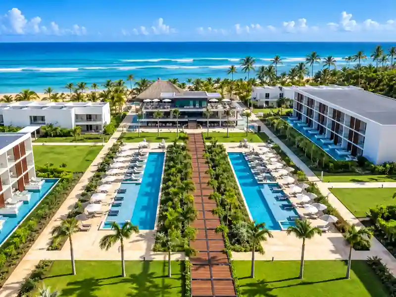 Aerial view of Punta Cana beachfront resort with swimming pools and Caribbean Sea