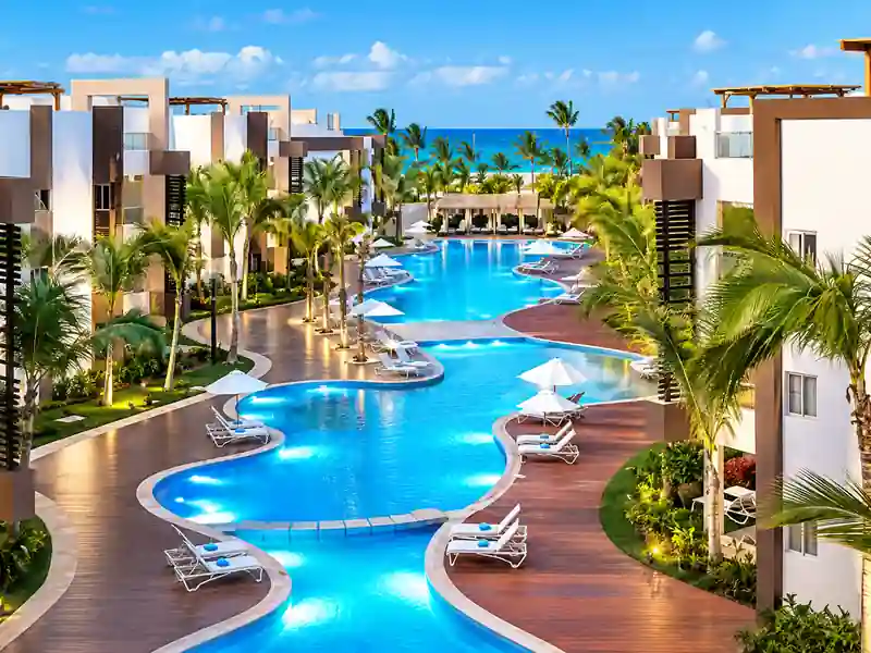 Modern Punta Cana resort suite with living room, full kitchen and tropical decor