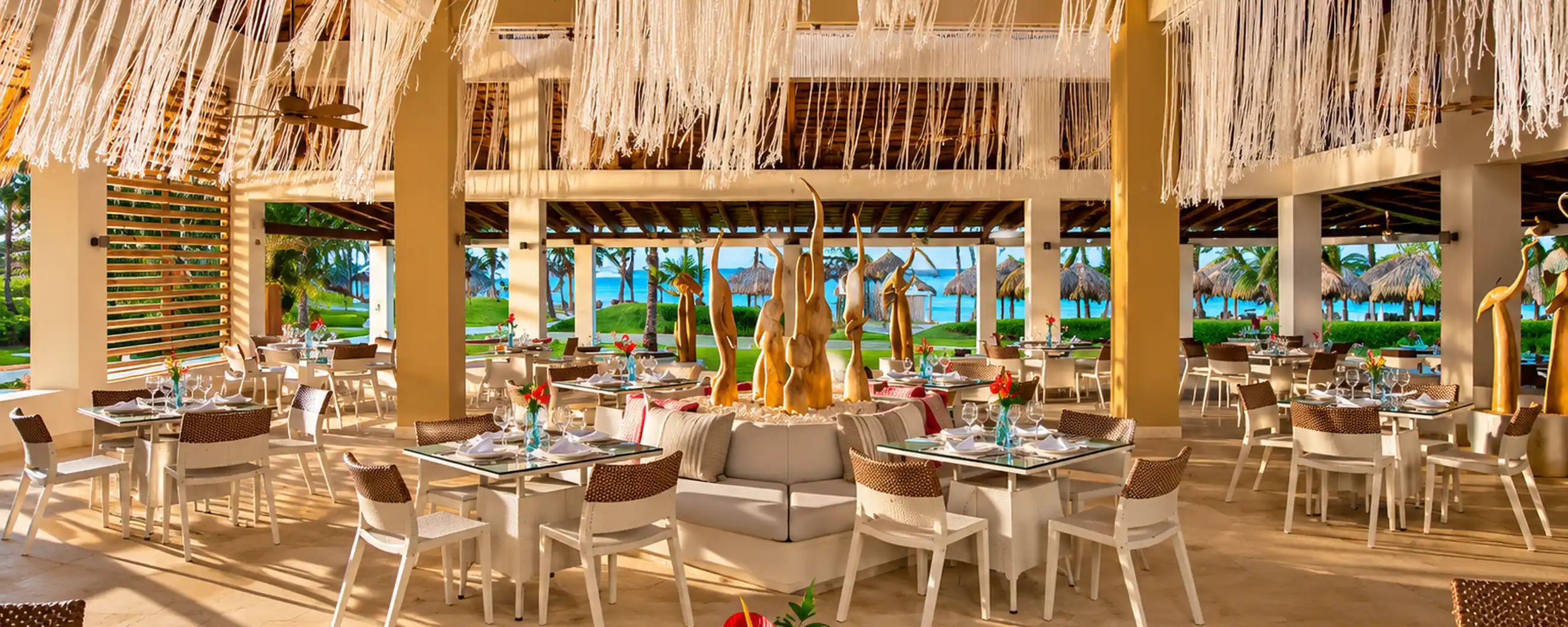 Luxury beachfront resort restaurant with tropical ocean views in Punta Cana