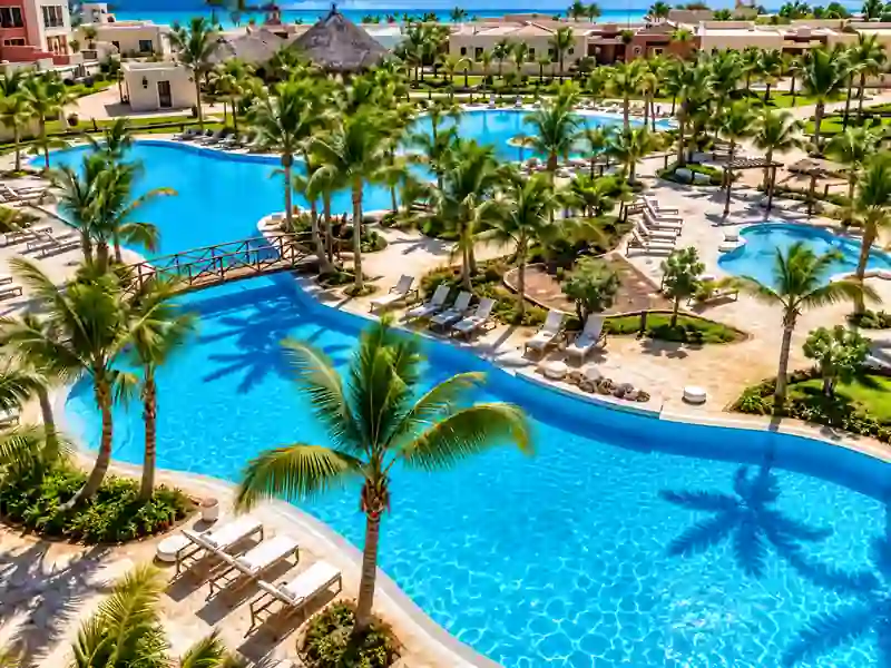 Bahia Principe Ambar tropical swimming pools with palm trees and resort gardens in Punta Cana
