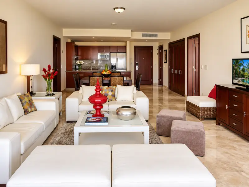 Luxury Punta Cana resort lagoon swimming pool with tropical palm trees and resort buildings