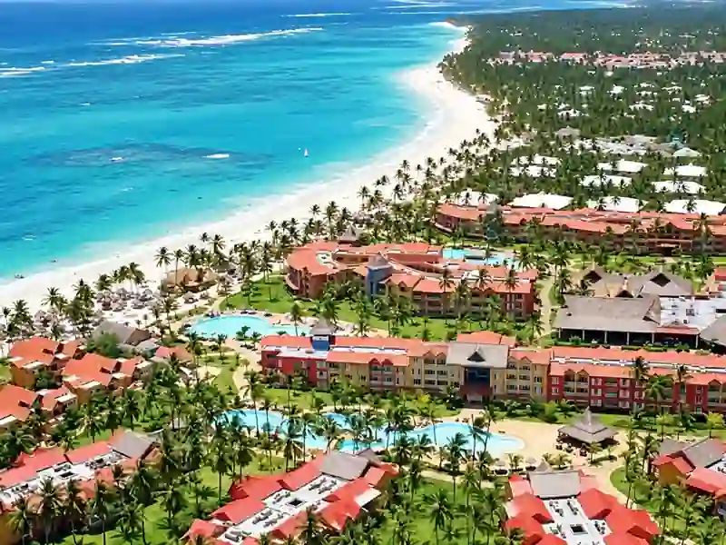 Aerial view of Caribe Deluxe Princess beachfront resort and turquoise Caribbean Sea in Punta Cana.