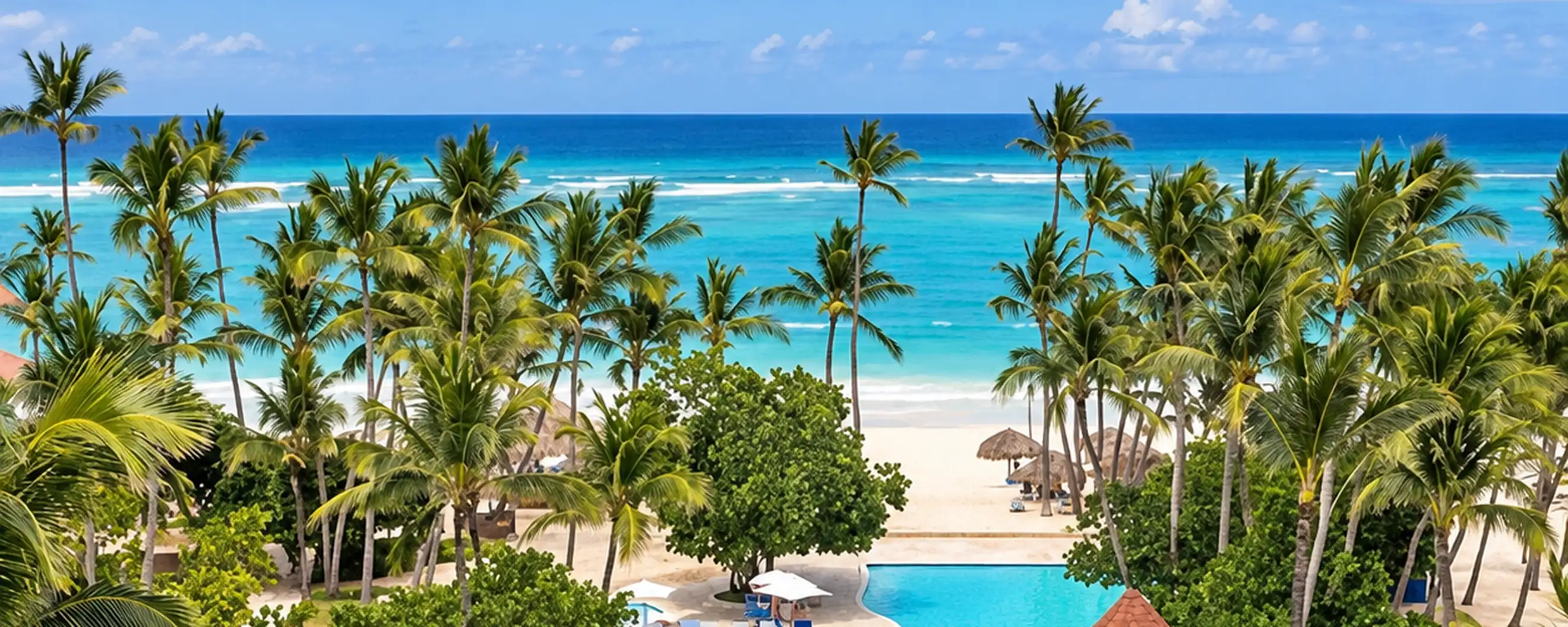 “Caribe Deluxe Princess Punta Cana tropical pool overlooking palm trees and the Caribbean Sea”