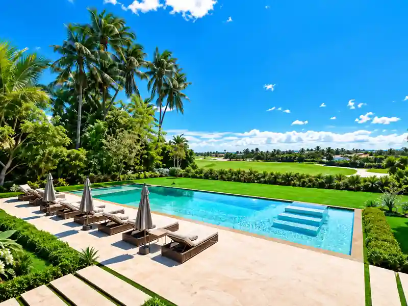 Cayuco 10 Cap Cana luxury private pool with tropical gardens and golf course view.