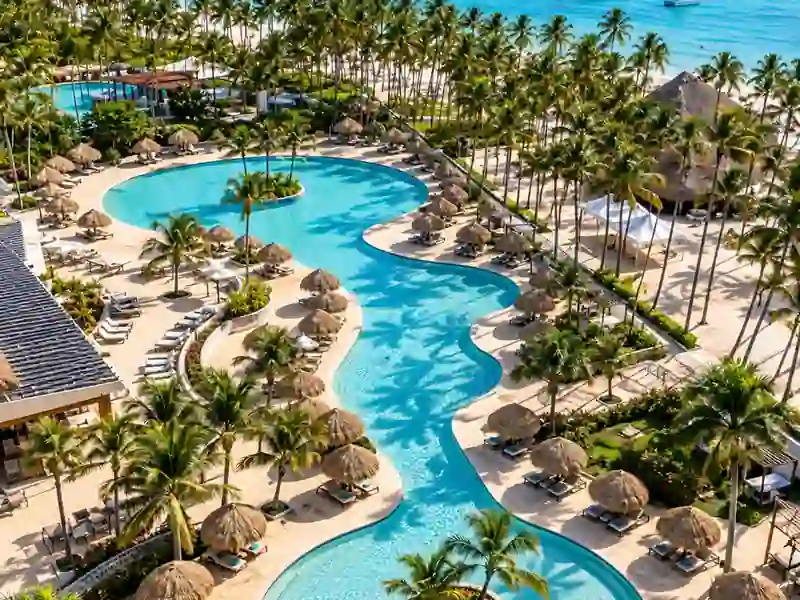 Club Med Punta Cana tropical swimming pool and Caribbean beachfront with palm trees
