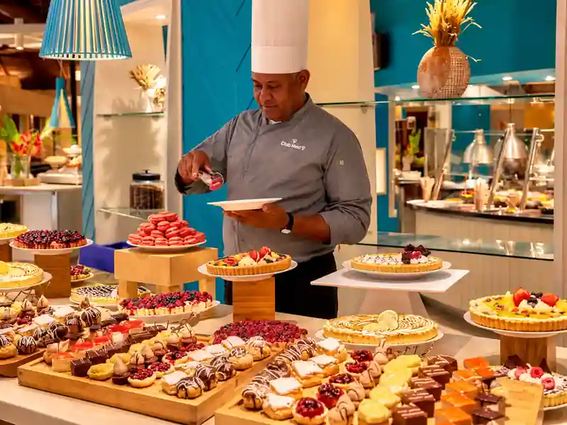 Club Med Punta Cana chef preparing desserts at the resort buffet