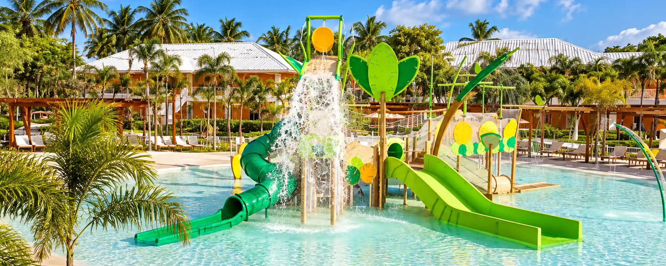 Club Med Punta Cana family water park with tropical palm trees and colorful slides