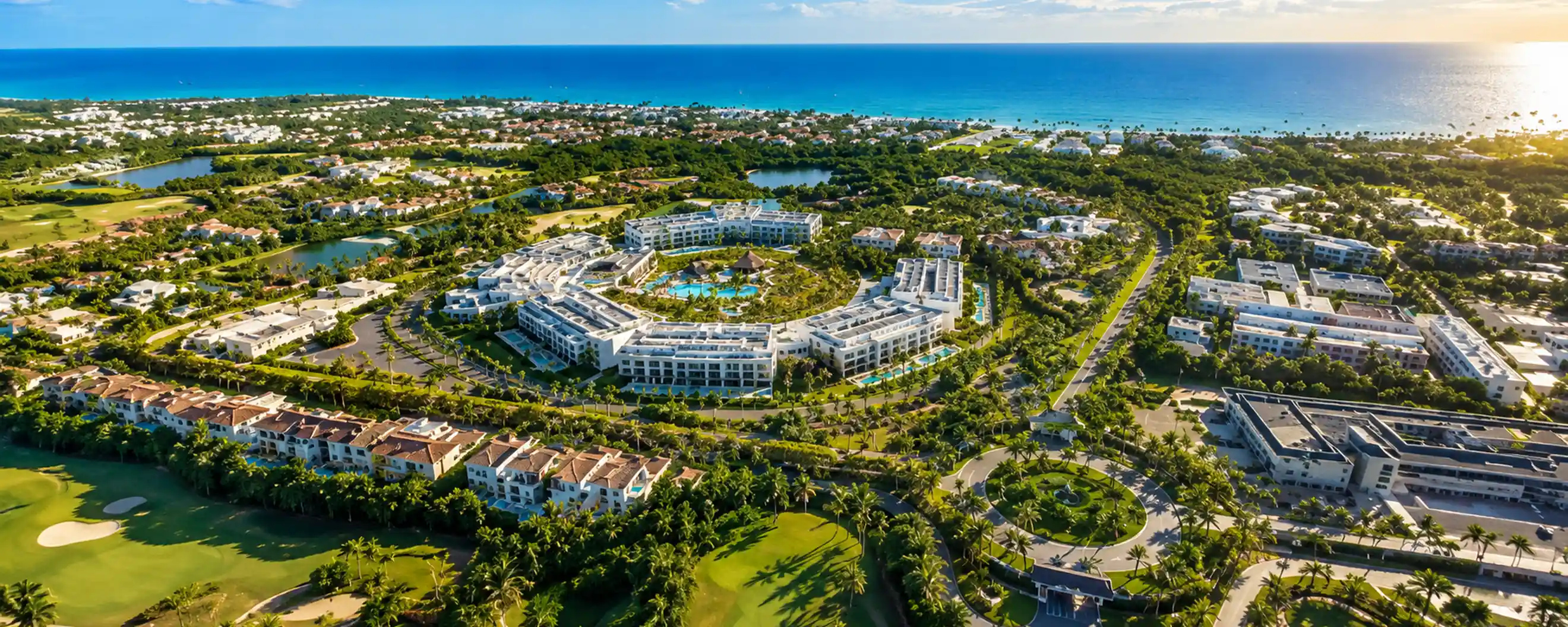 Aerial view of Cocotal Punta Cana with golf course, tropical residences and Caribbean coastline