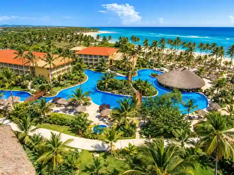 Aerial view of Dreams Cap Cana resort pools, tropical gardens and Caribbean beachfront