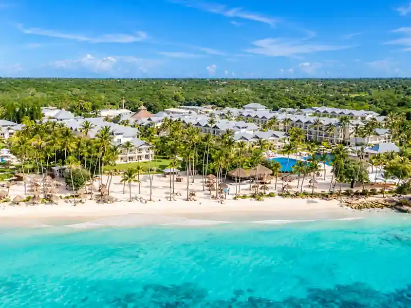 Aerial view of Dreams La Romana beachfront resort with turquoise Caribbean water