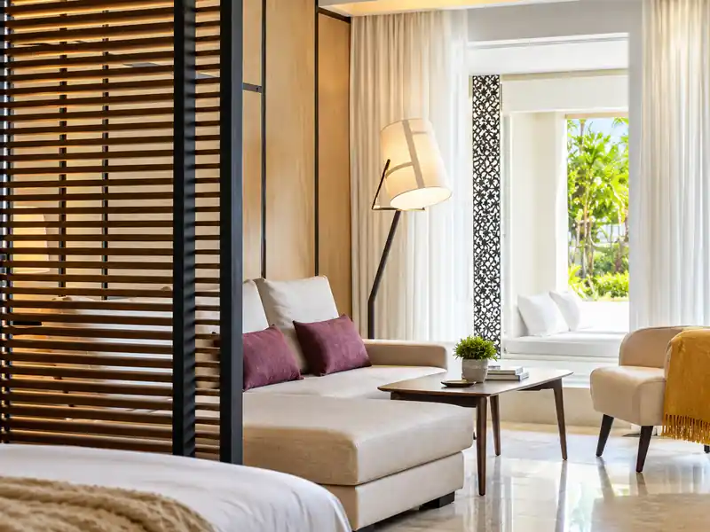 Excellence El Carmen hotel suite living area with modern tropical decor