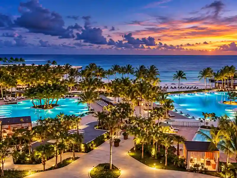 Four Seasons Cap Cana luxury resort pools and tropical beachfront at sunset
