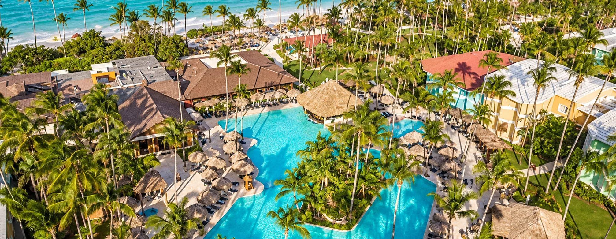 Aerial view of Grand Palladium Punta Cana Resort & Spa with tropical pools, palm trees and beachfront