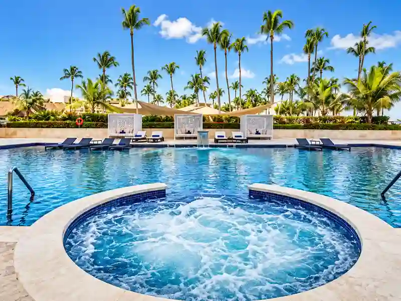 Hideaway at Royalton Punta Cana jacuzzi and luxury pool surrounded by tropical palm trees